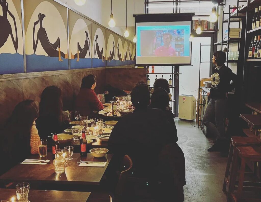 Barbara showing a video during an Italian class in a restaurant in London